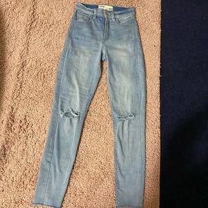 Garage light wash skinny jeans high rise